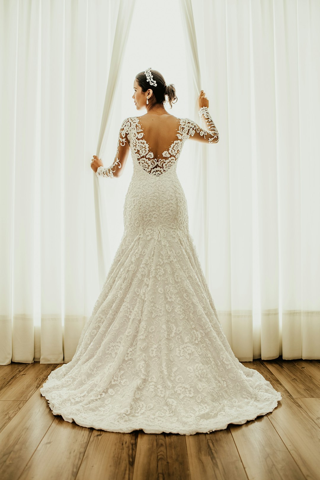 Bride in a white floral lace wedding gown