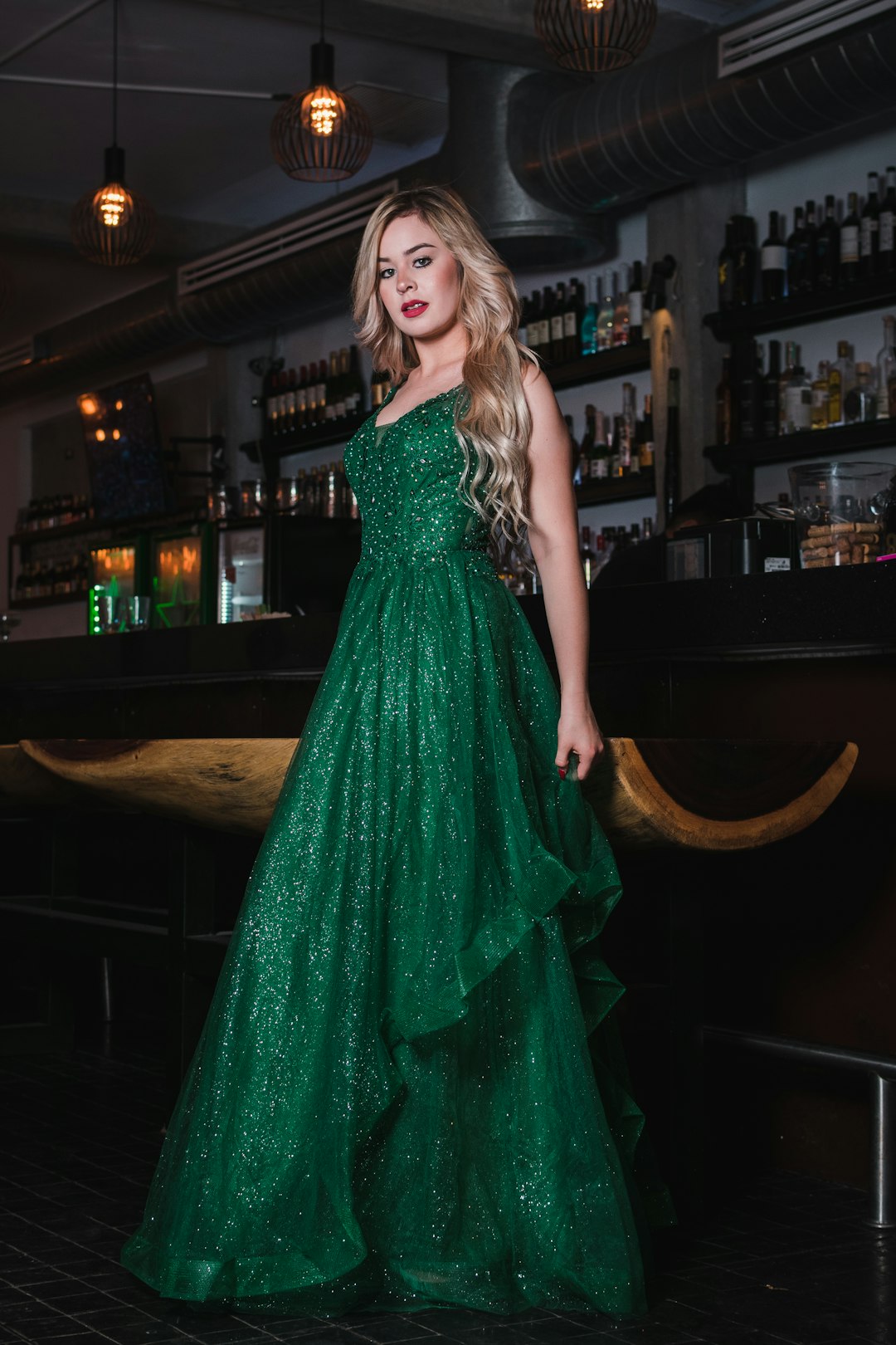Woman in a sparkling green prom gown